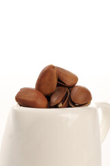 Hand-Peeled Red Pine Nuts from Northeastern Region in White Bowl - Large Natural Grain Texture