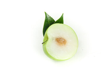Fresh Jujube Dates with Green Leaves Cut in Half Showing Honey Sweet Flesh and Pit on White Background