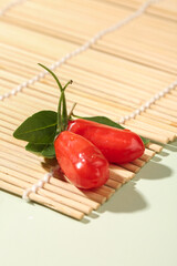 Fresh Red Goji Berries Wolfberries on Bamboo Mat Traditional Chinese Superfruit Ningxia