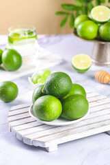 Fresh Green Limes on Wooden Board - Citrus Fruit Kitchen Scene