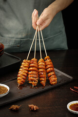 Grilled Spiced Henan Gluten Skewers Ready to Eat - Traditional Chinese Street Food on Wooden Sticks
