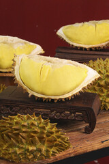 Fresh Golden Durian Fruit Segments on Wooden Tray - Exotic Tropical Asian Food