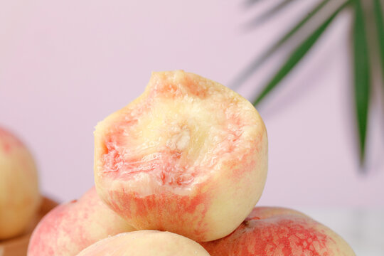 Fresh Yangshan Peach Cut in Half Showing Sweet Juicy Flesh and Fuzzy Skin