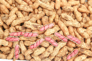 Fresh Raw Peanuts in Shells with Red Skin Cross-Section Healthy Organic Nuts Background