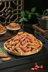 Fresh Red Skin Peanuts in Shells on Bamboo Plate Traditional Asian Food Setting