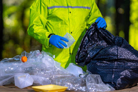 Garbage trash disposal helps restore ecosystems. Plastic trash collection makes a difference. Rubbish trash cleanup concept. Volunteers and trash waste recycling reduces pollution.