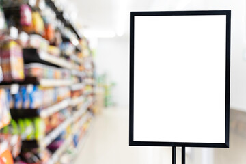 Blank retail sign board in supermarket aisle for advertising mockup, product promotion and marketing design
