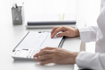 Fototapeta premium Auditor or internal revenue service staff, Business women checking annual financial statements of company. Audit Concept.
