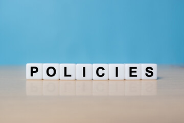 Fototapeta premium Word POLICIES made with dice building blocks