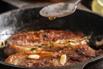 Beef steaks are pan-seared and topped with their own juices and sauce. High quality photo