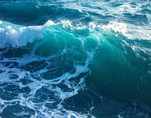 Close-up of a dynamic ocean wave, showcasing its translucent turquoise hue and foamy crest as it breaks. Water's surface detail