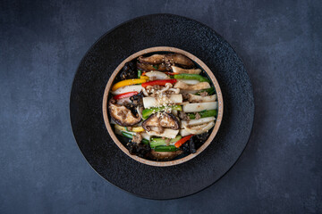 Colorful Stir-fried Vegetables with Mushrooms and Peppers in a Bowl