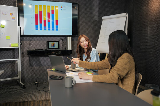 Business woman meet team, busy people discussing work project during important meeting, reviewing charts, creating company strategy in modern conference room - Powered by Adobe