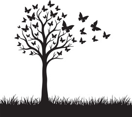 Black tree with butterflies flying away over grass