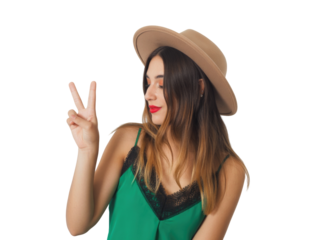 Young woman wearing a hat and green top making peace sign, isolated isolated on transparent background