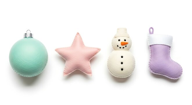 Festive Christmas Ornaments Mint Green Bauble Pink Star Snowman and Lavender Stocking on White Background Overhead Studio Shot