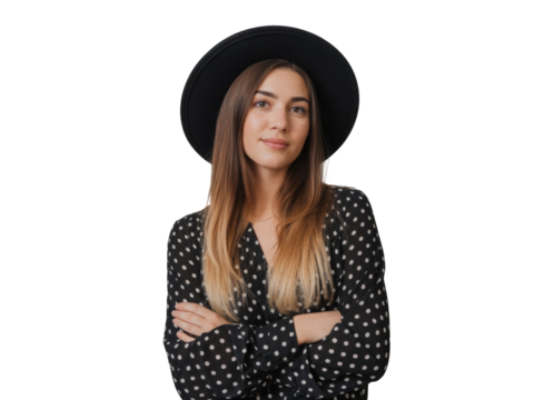 Young woman wearing a black hat and polka dot dress with arms crossed isolated on transparent background