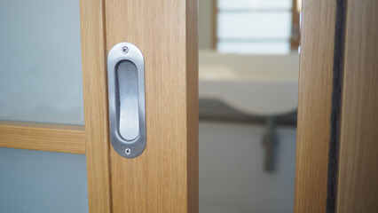 Elegant wooden door handle with modern design features