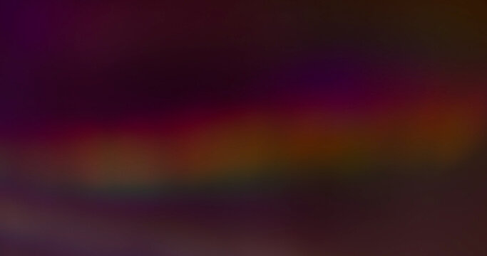 Lens prism blur. Holographic glow leak. Spectrum color luminosity on night background. Purple red green neon stripe abstract flash texture.