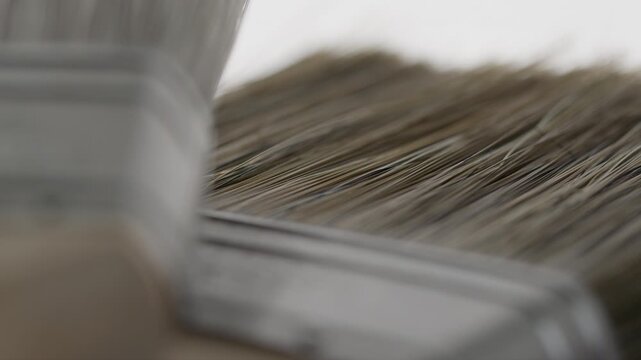 High Quality Video of close-up on Farrow and Ball paintbrush bristles and handle. Detailed view of bristle texture and craftsmanship, ideal for precision painting tasks.