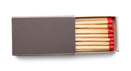 A dark gray matchbox with several wooden matches with red tips neatly arranged inside isolated on white background
