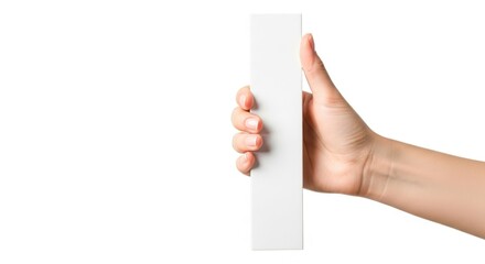 A person s hand holding a tall thin white object vertically isolated on white background