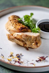 Grilled chicken fillet with sauce