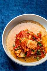 Spicy squid in tomato sauce top view