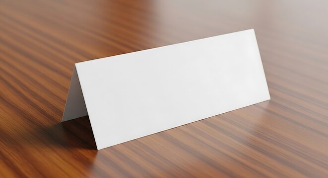 Blank white tent card on a wooden surface