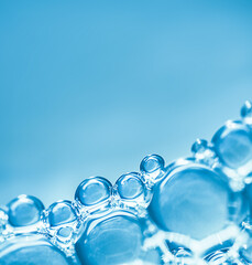 close-up of air bubbles on a light blue background. copy space