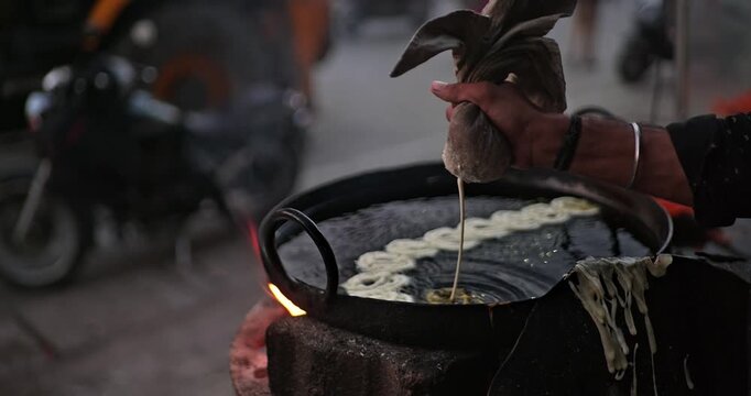 Traditional Indian Jalebi Making &ndash; Batter Pouring, Frying, and Dipping in Sugar Syrup