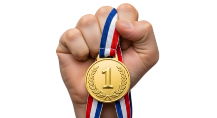 Triumphant fist holding a gold medal for first place achievement