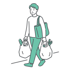両手に買い物袋を持って歩いている若い男性
