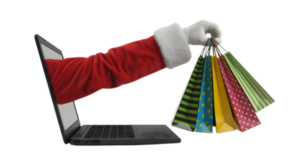 A hand emerges from a laptop screen holding colorful gift bags for holiday shopping.