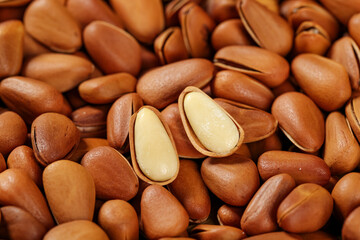 Fresh Pine Nuts with Open Shells Revealing White Kernels - Natural Healthy Food Ingredient Close-up