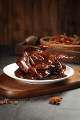 Smoked Quail with Soy Sauce Glaze - Traditional Asian Cuisine on Rustic Wooden Table