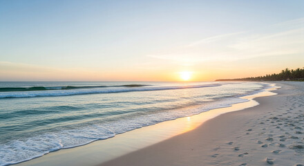 Seascape with gentle waves washing over a sandy beach at sunset