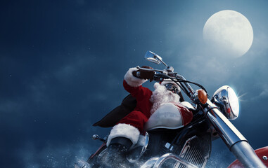 Obraz premium Biker Santa Claus riding a motorbike