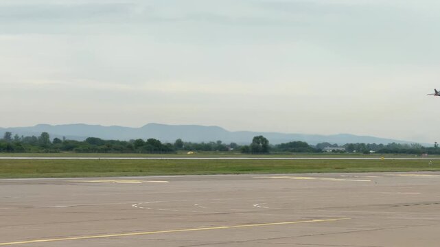 Croatian Air Force Dassault Rafale Fighter Aircraft Lifting Off The Runway With Landing Gear Still Down. wide shot