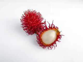 Fresh red rambutan fruit with white flesh isolated on white background