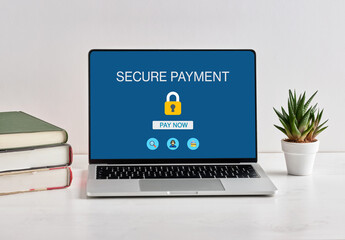 Secure online payment on laptop with padlock icon displayed on screen