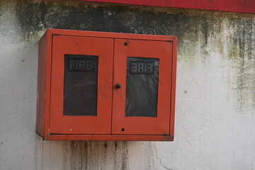Red Fire Safety Cabinet. Rectangular, red cabinet, fire hose or fire extinguisher cabinet, mounted...