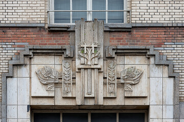Marvelous art deco architectural detail featuring intricate stone carvings and geometric shapes evoking the glamour of a bygone era, perfect for retro design concepts