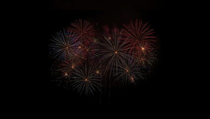 Fototapeta premium Multicolored fireworks display against a black background, used for celebration and holiday events, New Year's Eve