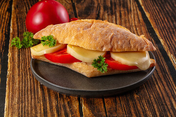 Sandwich with mozzarella and tomato