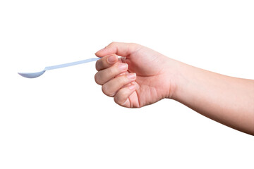 Female hand holding a white plastic spoon isolated on white background.