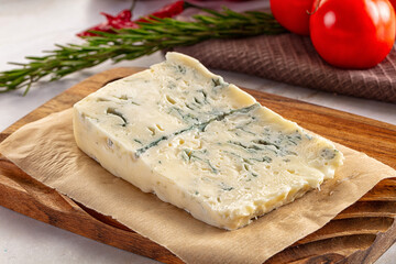Tasty Italian gorgonzola cheese over board
