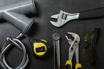 Repair tools, plumber, locksmith, electrician on concrete floor
