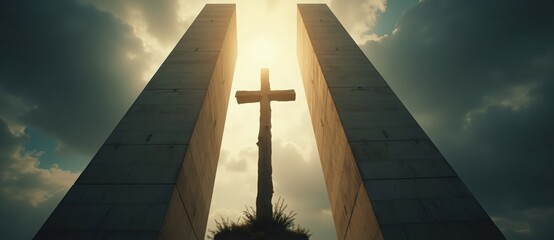 A wooden cross silhouetted between modern concrete pillars against a bright sky. Dramatic low angle view of a religious monument. Christianity, faith, and hope concept