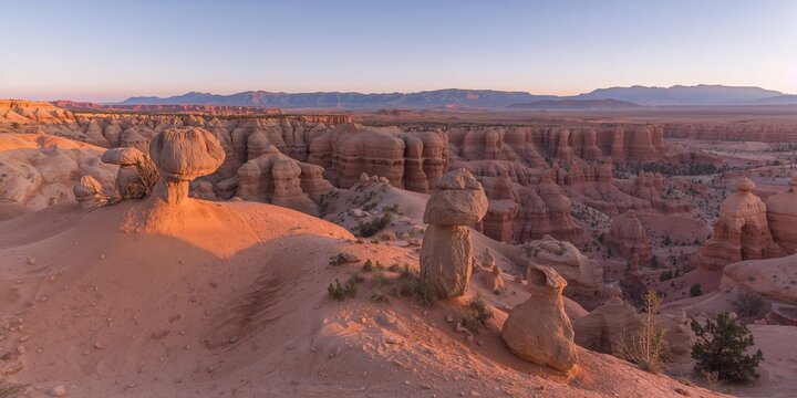 Desert landscape featuring mushroom-shaped rock formations in Utah's Grand Staircase Escalante national monument, ideal for geological exploration